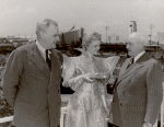 General Motors - Miss Futurama presenting model 1960s car to Harvey Gibson