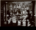 Anna May Wong in background with unidentified actors in foreground in the motion picture Limehouse Blues [aka Limehouse Nights]