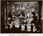 Anna May Wong in background with unidentified actors in foreground in the motion picture Limehouse Blues [aka Limehouse Nights]
