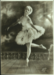 Early full-length studio portrait of Ruth Page on pointe in short tutu and white wig