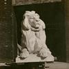 Photograph of the  southerly lion mounted on a dolly in the Piccirilli Brothers yard in the Bronx