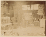 Plaster workshop : men working on models, including a Corinthian capital