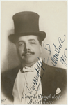 Autographed full-face portrait photo of Serge Diaghilev in top hat.
