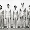 Twyla Tharp with four unidentified female dancers lined up along wall