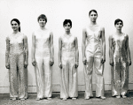 Twyla Tharp with four unidentified female dancers lined up along wall