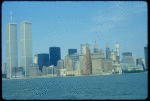 View of lower Manhattan skyline with Twin Towers at left.