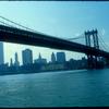 View from Brooklyn of Manhattan skyline with Manhattan Bridge in foreground.