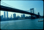 View from Brooklyn of Manhattan skyline with Manhattan Bridge in foreground.
