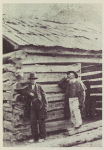 Dennis and John Hanks standing beside the old Lincoln home. 1865