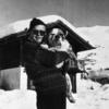 Truman Capote with dog in snow (with note from Capote on reverse)