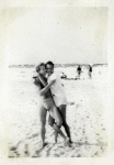 Frank Thompson and friend embrace at Long Beach