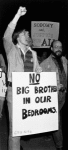 Demonstrator holding "No big brothers in our bedrooms, G.P.U.-N.Y.U." sign