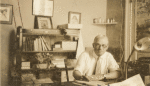 Samuel T. Clover at his desk in Los Angeles