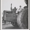 Robert Moses seated on a tractor