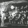 Far shot of Jimmie Lunceford and his orchestra during a performance; Sy Oliver on trumpet