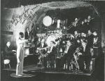 Far shot of Jimmie Lunceford and his orchestra during a performance; Sy Oliver on trumpet