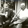 Henry Cowell demonstrating shakuhachi to Varese