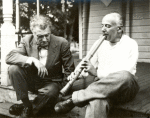 Henry Cowell demonstrating shakuhachi to Varese