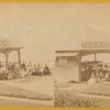 Group of people in front of the ice cream stand.