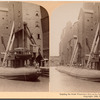 Loading the great whaleback ship at the famous grain elevators, Chicago, U.S.A.