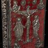 Front cover: red velvet with silver repoussé of Jesus on the cross with the Virgin Mary at left and St. John at right and busts of the four Evangelists in each corner