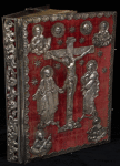 Front cover: red velvet with silver repoussé of Jesus on the cross with the Virgin Mary at left and St. John at right and busts of the four Evangelists in each corner