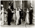 Julie Andrews and Rex Harrison (center) and cast in the stage production My Fair Lady.