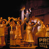 Robert Preston (in background) and cast in the stage production The Music Man