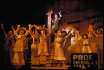 Robert Preston (in background) and cast in the stage production The Music Man