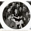 Publicity photo of Deanna Durbin surrounded by servicemen