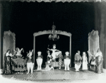 Ula Sharon and Carl Randall (center stage) in the "Alice in Wonderland" scene in the stage production Music Box Revue