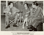 Unidentified man, Nancy Kwan, and William Holden on the set of the motion picture The World of Suzie Wong