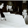 Julie Andrews, Rex Harrison (standing), Alan Jay Lerner, and Frederick Loewe (seated) at white grand piano
