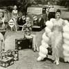 Gypsy Rose Lee on the road with Rolls Royce with Show Girls [curves ahead sign]