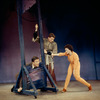 Dick Van Dyke with head in guillotine, unidentified actor, and Chita Rivera in Bye Bye Birdie.