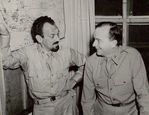 Moss Hart confers with Major Maurice Evans regarding the stage production The Man Who Came to Dinner