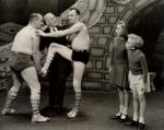George M. Cohan with acrobats and unidentified child actors in the stage production I'd Rather Be Right.