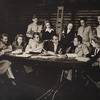 Moss Hart (center, holding script) with cast during rehearsals for the stage production Winged Victory