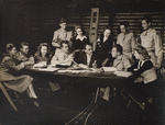 Moss Hart (center, holding script) with cast during rehearsals for the stage production Winged Victory