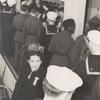 Service men on line and mingling in the Stage Door Canteen.