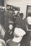 Service men on line and mingling in the Stage Door Canteen.