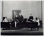 George Stillwell (center), Zita Johann as secretary (extreme left), and other cast members in the stage production Machinal