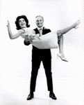 Jack Cassidy holding Patricia Marand in his arms.
