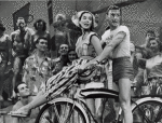 Jack Cassidy on bike with cast members in the stage production Wish You Were Here.