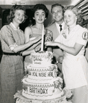 Publicity photo of Jack Cassidy and three unidentified women celebrating the one year anniversary of the stage production Wish You Were Here.