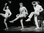 Jenny O'Hara, Dorothy Loudon and David Cassidy kicking up their left legs in a scene from The Fig Leaves are Falling