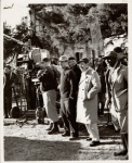 Director Elia Kazan, author Tennessee Williams, and crew members watching the filming of a scene from the motion picture Baby Doll