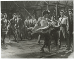 Rita Moreno performing "America" in the motion picture West Side Story. Suzie Kaye and Yvonne Othon on far left and George Chakiris on far right.