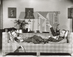 Gertrude Lawrence and Noel Coward on sofa in "Private Lives."