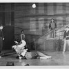 Carol Lawrence cradling Larry Kert surrounded by cast members in the stage production West Side Story